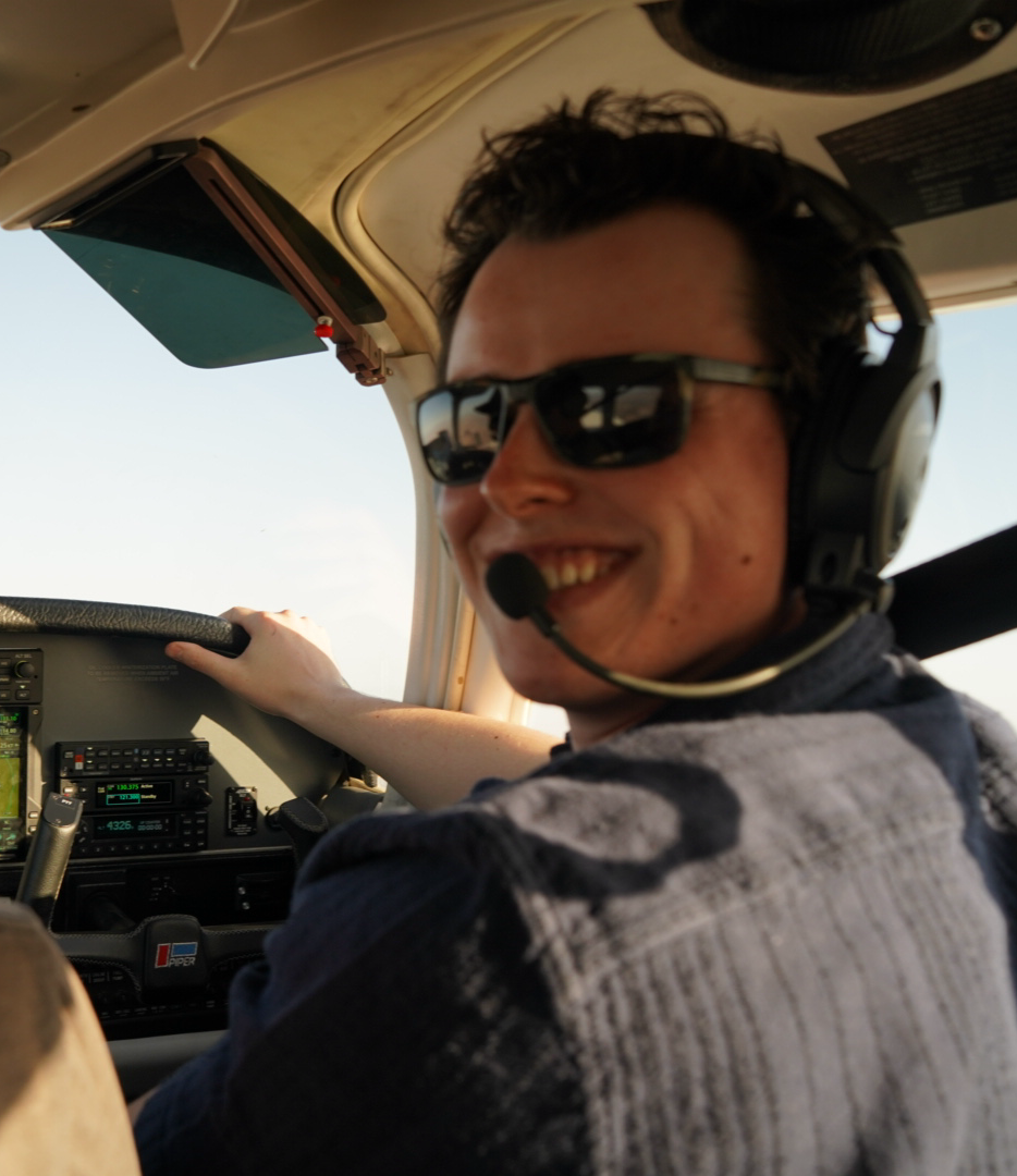 Nathan Bey-Smith in the cockpit at golden hour